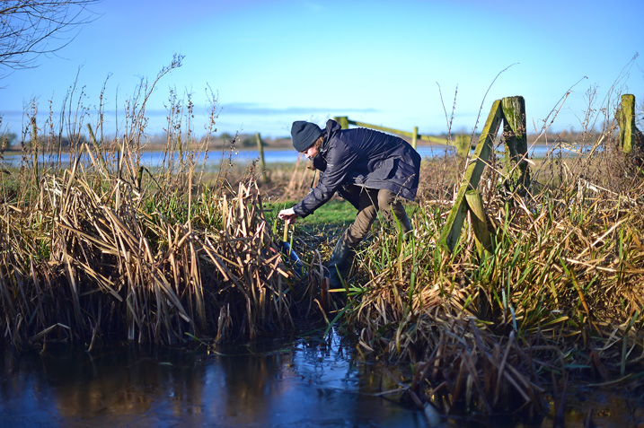 The warden checking water levels and altering pipes in the waterways out on the reserve