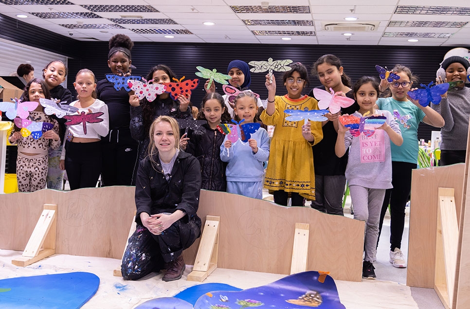 Local youth groups inspire Gloucester city shoppers with flourishing floodplain art installation